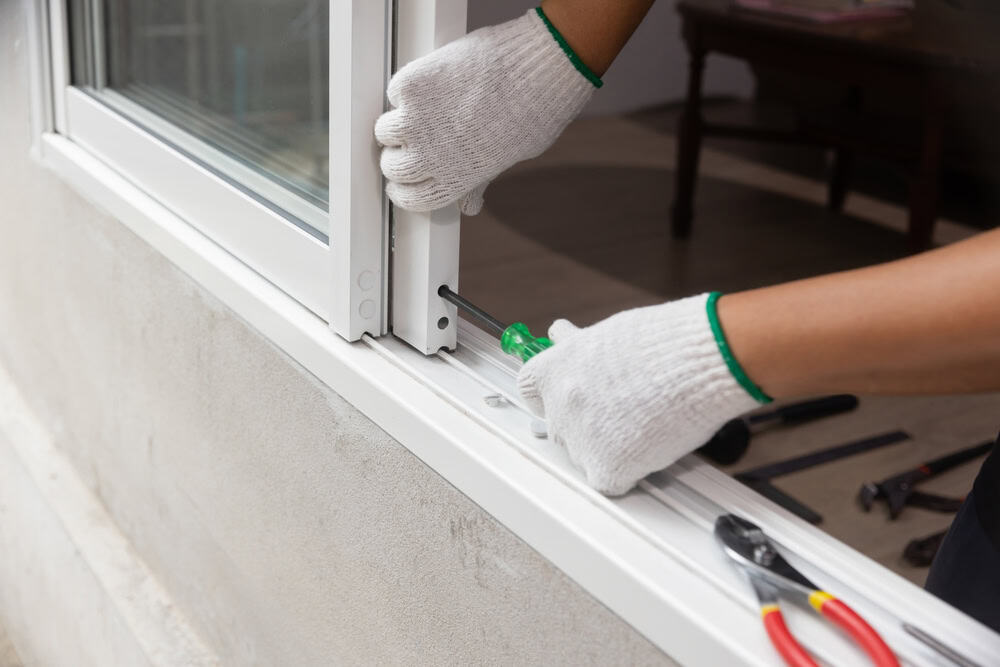 Installing a new window frame with precision and care.