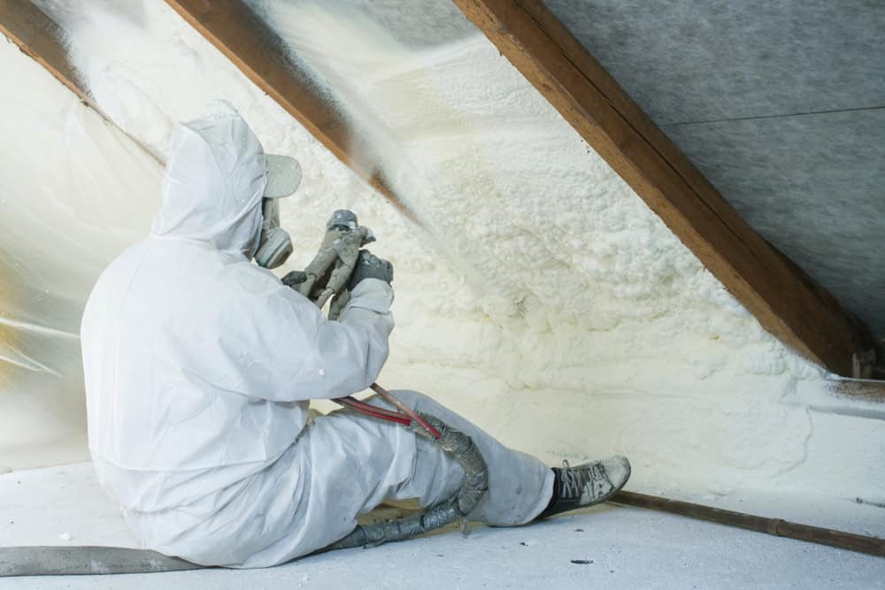 Spray foam insulation in progress—sealing in energy efficiency one layer at a time.