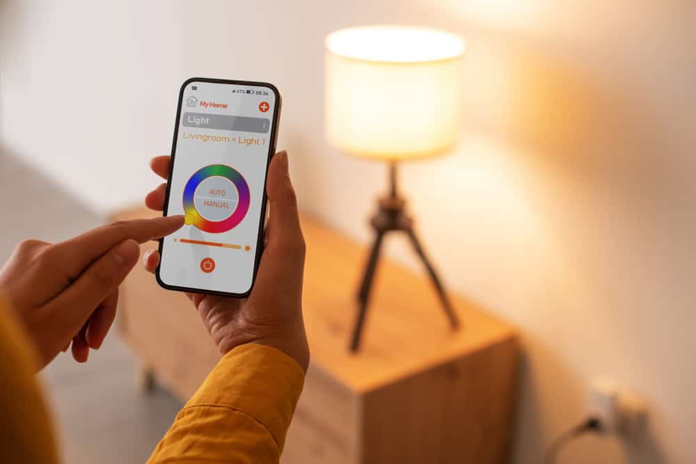 Controlling the ambiance with a tap: smart lighting at its finest.