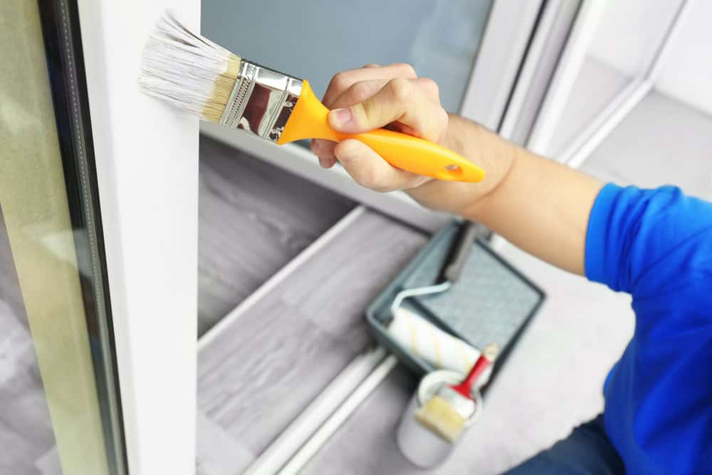 Painting the door frame with precision and care.