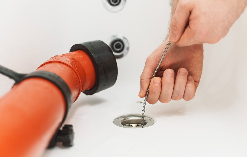 Clearing a stubborn clog with precision and patience.