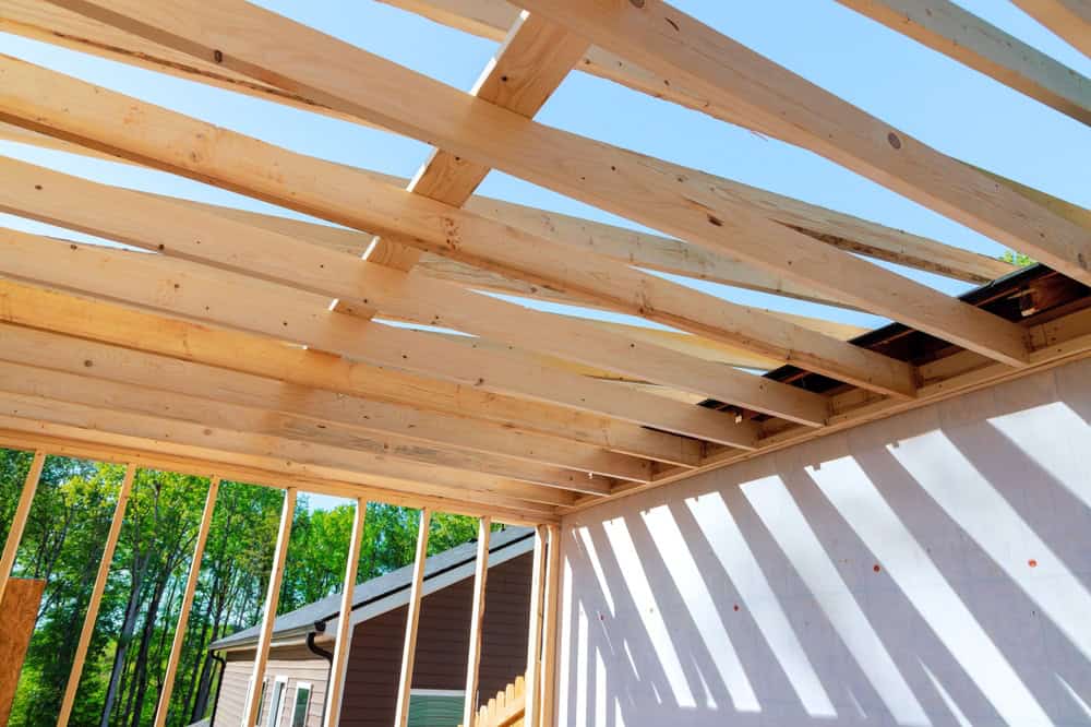 Building dreams from the ground up: a new home's roof takes shape.