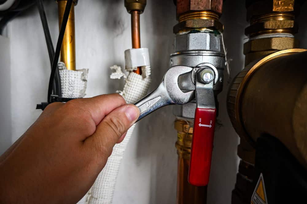 Tightening the valve with precision, ensuring a secure and leak-free connection.