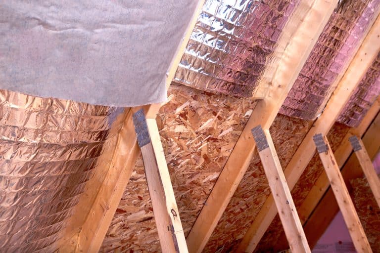 Energy-efficient attic insulation with radiant barrier for better temperature control.