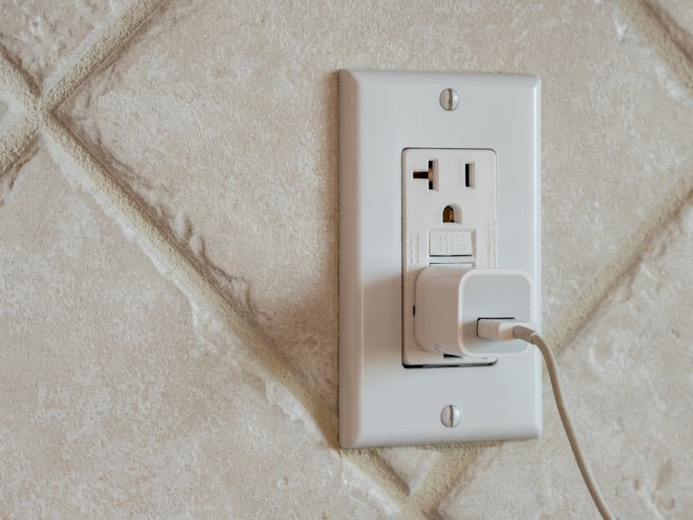 A USB charger plugged into a wall outlet, ready to power up your devices.