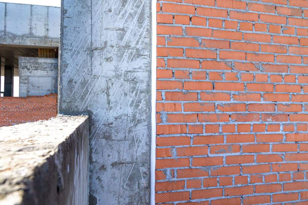 A tale of two textures: smooth concrete meets rustic brick.