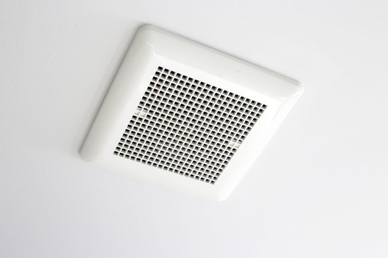Ceiling-mounted air vent adds a clean, modern touch while ensuring proper ventilation.