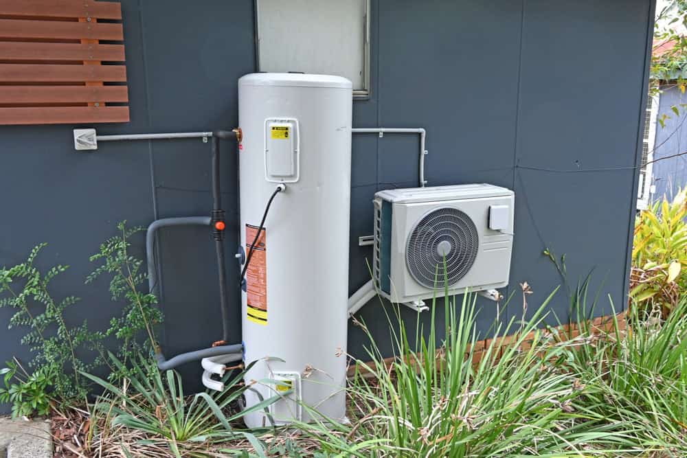 Energy-efficient heat pump water heater system installed outdoors.