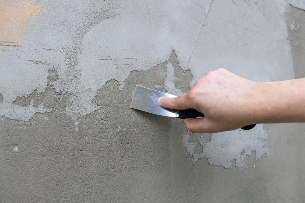 Smoothing out imperfections—repairing a damaged wall with precision.