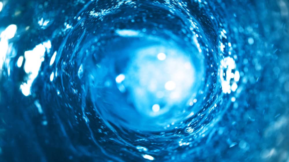 Diving into the heart of a swirling blue vortex