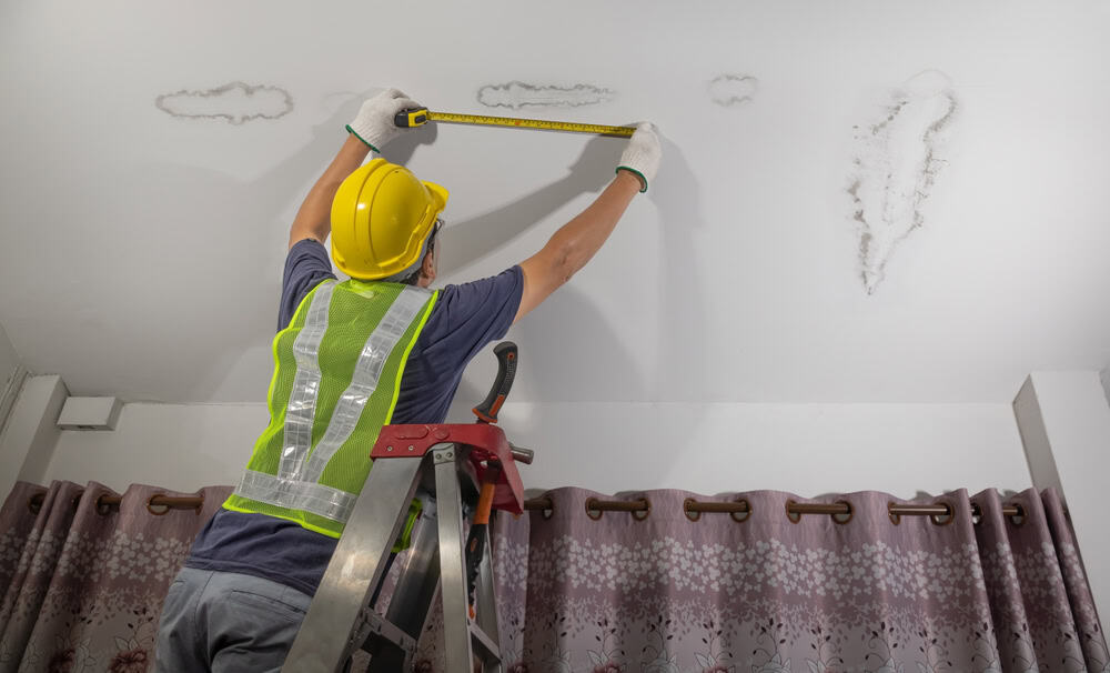 Measuring the damage: Identifying a ceiling leak's spread.