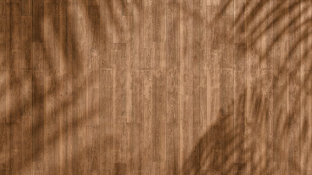 Tropical shadows dance on sun-kissed wood.