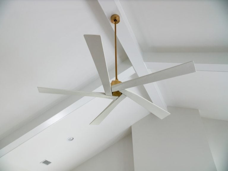 Modern ceiling fan with geometric design.