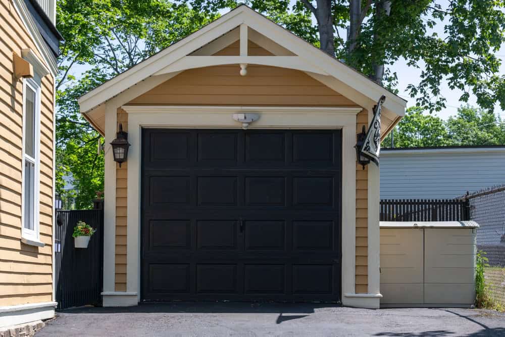 Charming small-town garage with classic black doors