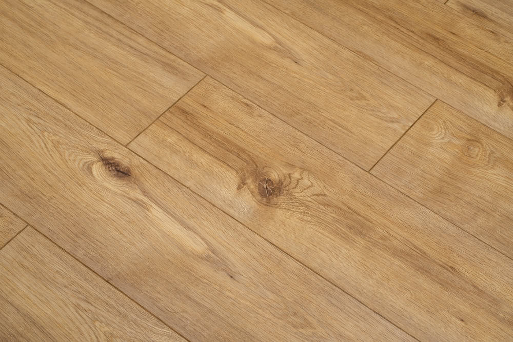 Warm oak wood flooring with natural grain patterns for a cozy, rustic charm.