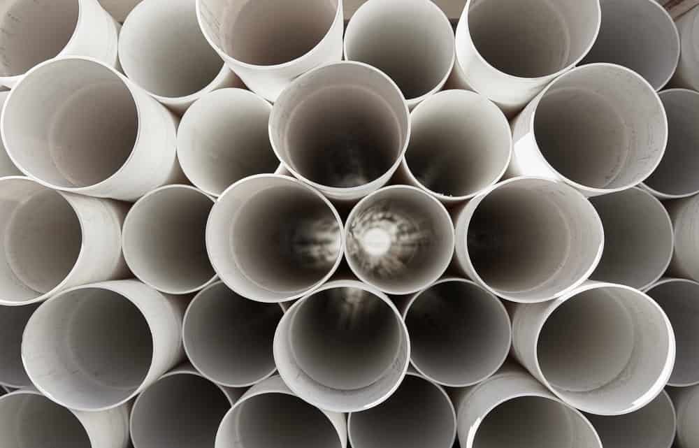 Stacked PVC pipes.