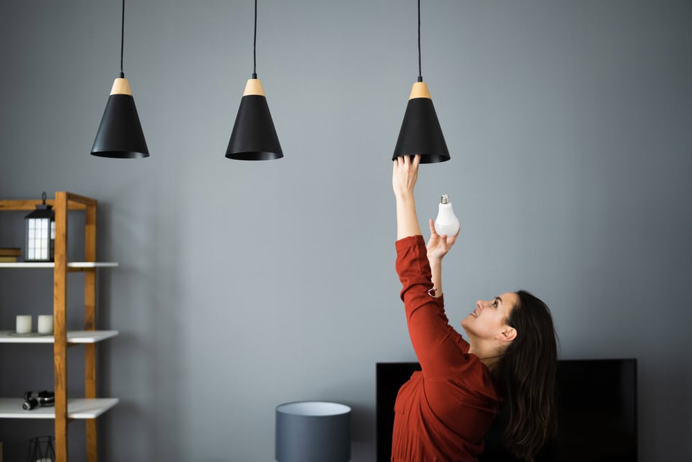 Brightening up the living room with new energy-efficient bulbs.