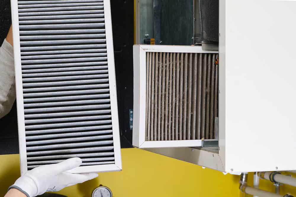 Out with the old, in with the clean—swapping dirty HVAC filters for fresh air and efficiency.