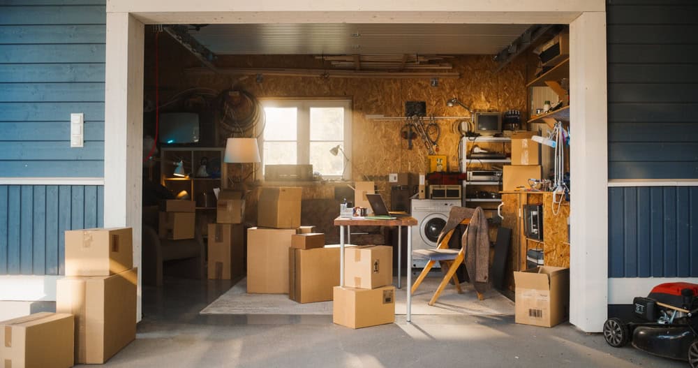 Garage life: between moving boxes, vintage tech, and lawn care.