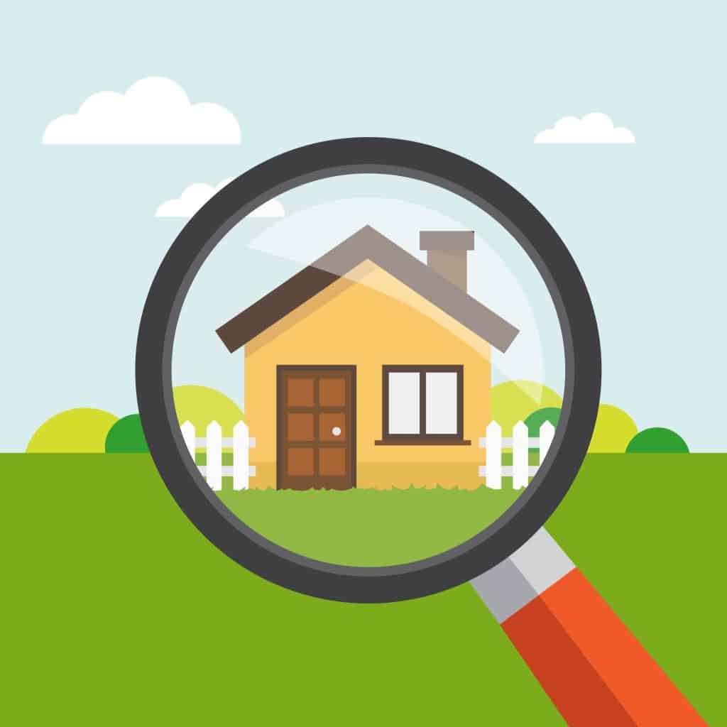 House hunting: A magnifying glass focuses on a cozy yellow home with white picket fence under blue skies