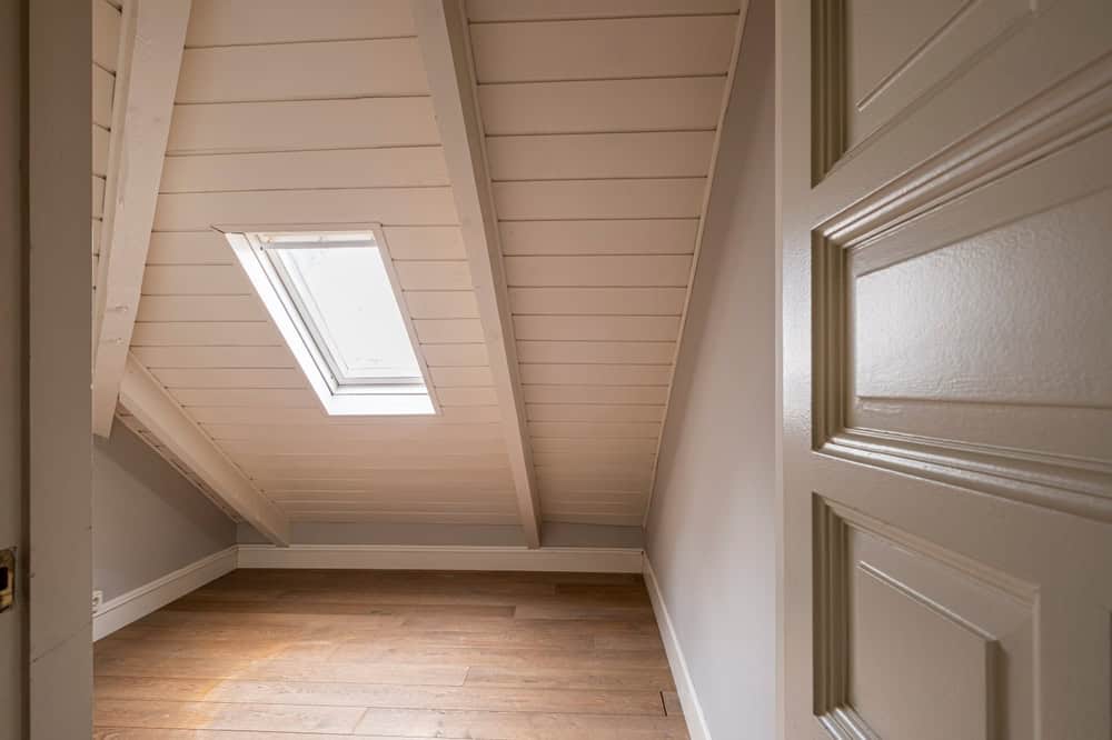 Cozy attic nook with a skylight, perfect for a quiet retreat or creative space.