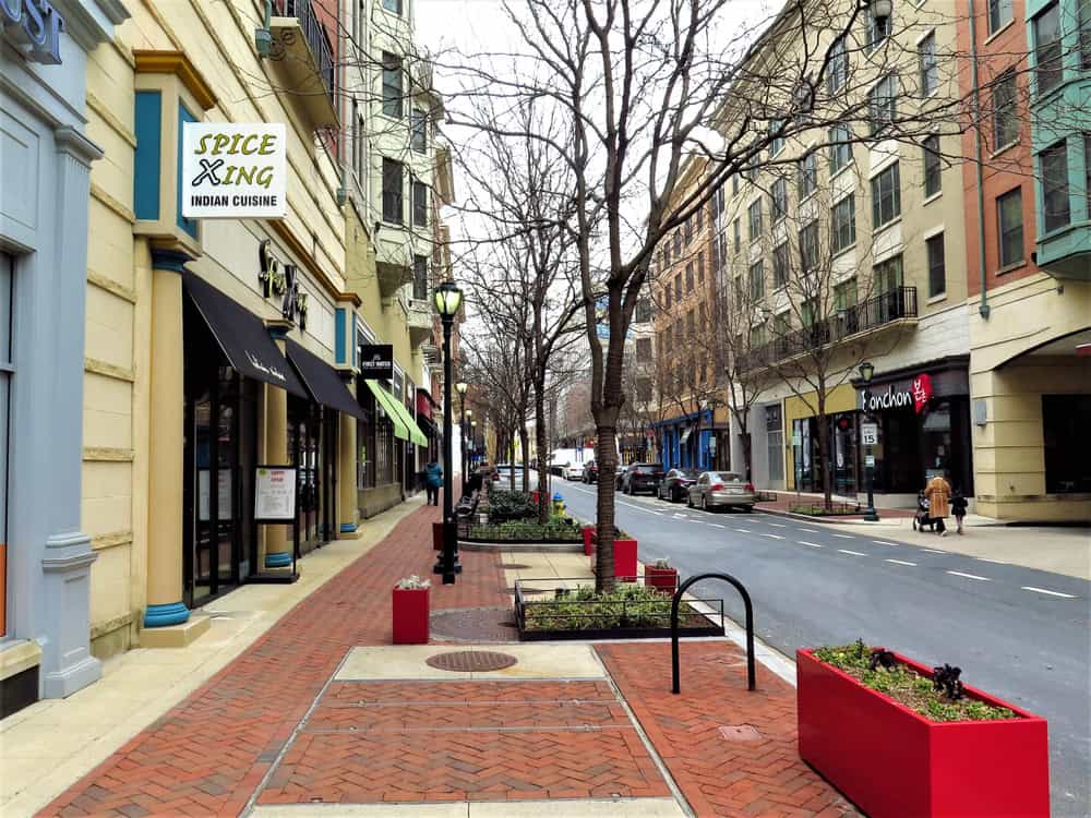 Downtown sidewalk scene, featuring "Spice Xing" Indian cuisine.