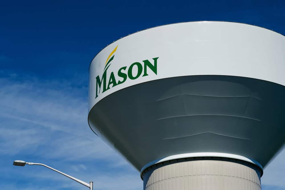 The iconic Mason water tower stands tall against a clear blue sky.