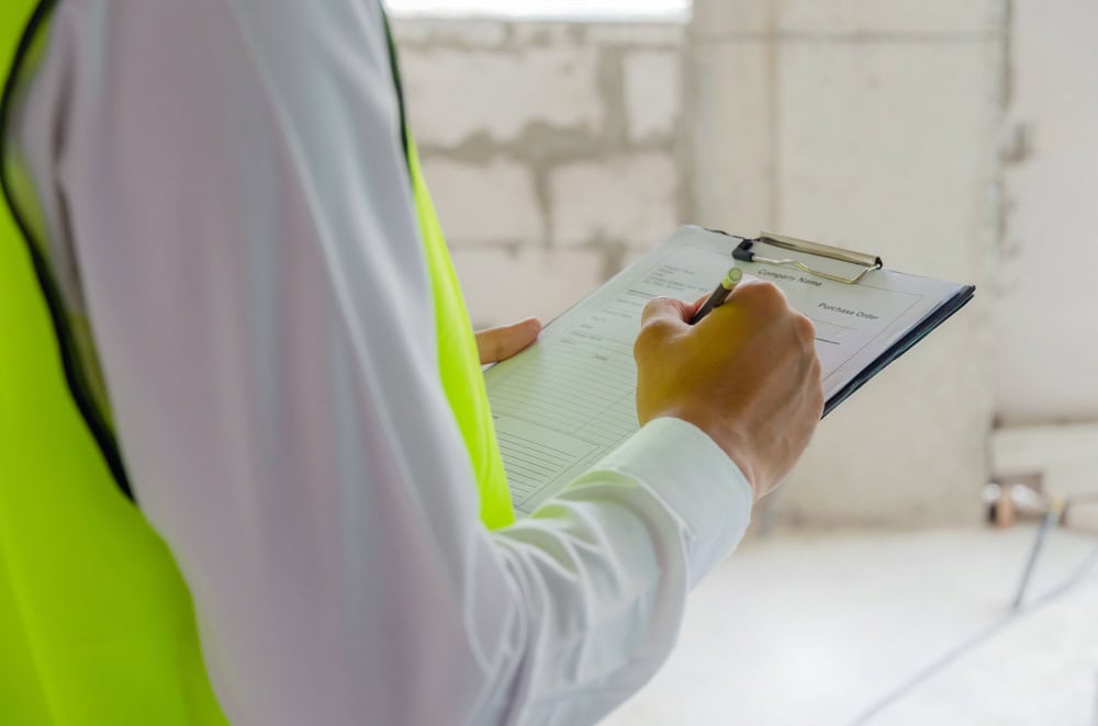 Precision in progress—construction inspector assessing details on-site.