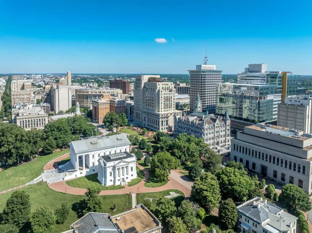 A stunning aerial view of Richmond, Virginia, showcasing the historic Virginia State Capitol and the city's vibrant downtown skyline.
