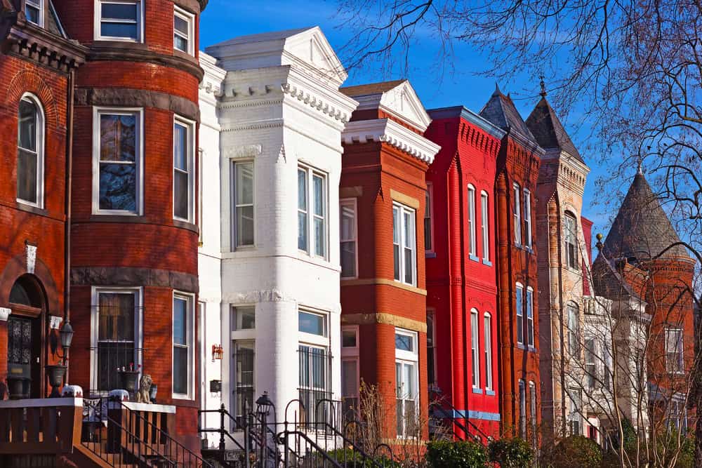 Colorful row houses in Washington D.C., showcasing a blend of architectural styles and vibrant hues.