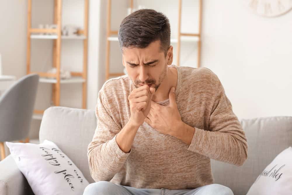 Coughing fit in the living room.