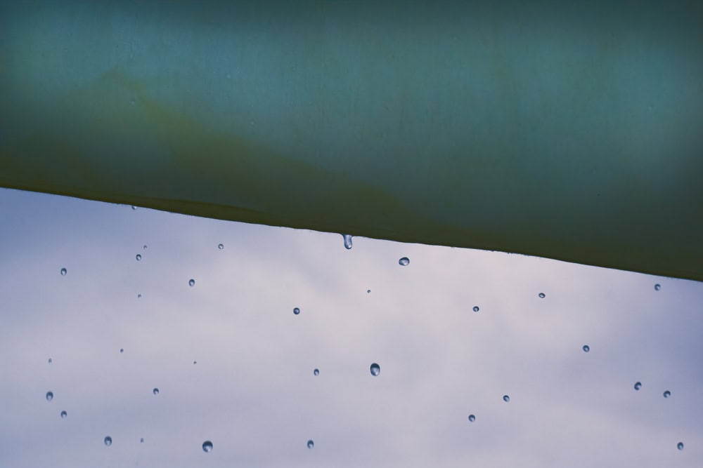 Raindrops dance in midair, reflecting the rhythm of the storm.