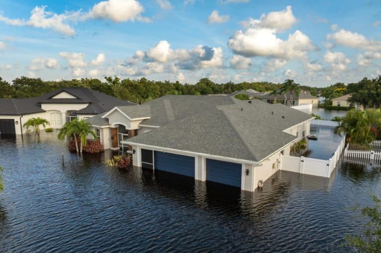 Homes submerged in floodwaters, showcasing the devastating impact of a natural disaster.