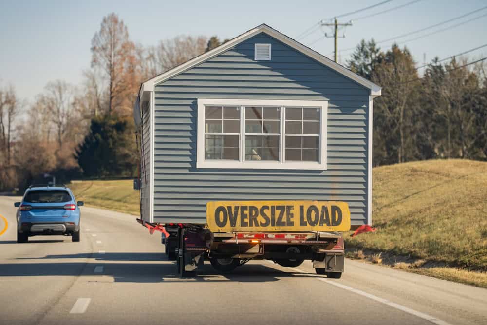 A house on the move: an oversized load travels down the highway.