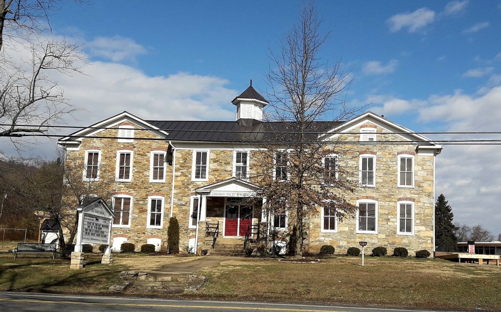 Historic Charm: Hillsboro Old Stone School Stands Proud Against a Blue Sky