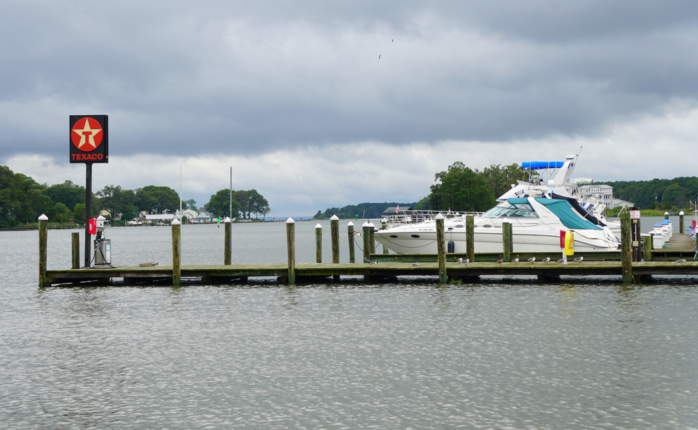 Boats docked at a serene Texaco marina on a cloudy day.
