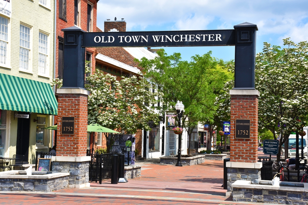 Welcome to Old Town Winchester: A charming historic district established in 1752, where brick buildings, blooming trees, and quaint shops invite you to stroll through centuries of American heritage.