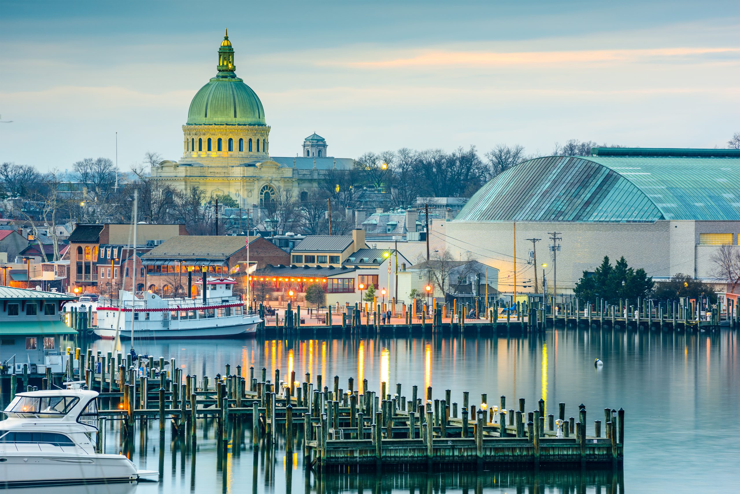 Annapolis Illuminated: Maryland's Capital Shines at Dusk, Naval Academy Chapel Towers Over Historic Harbor in Anne Arundel County