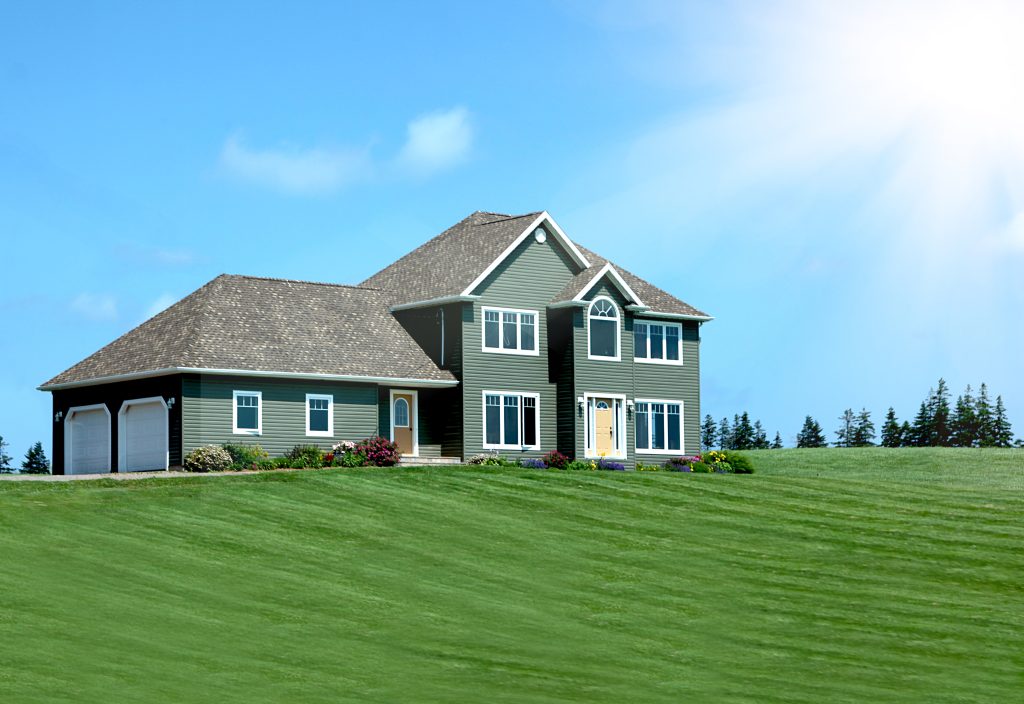 Sunlit splendor: a modern home standing majestically atop a lush, green hill.