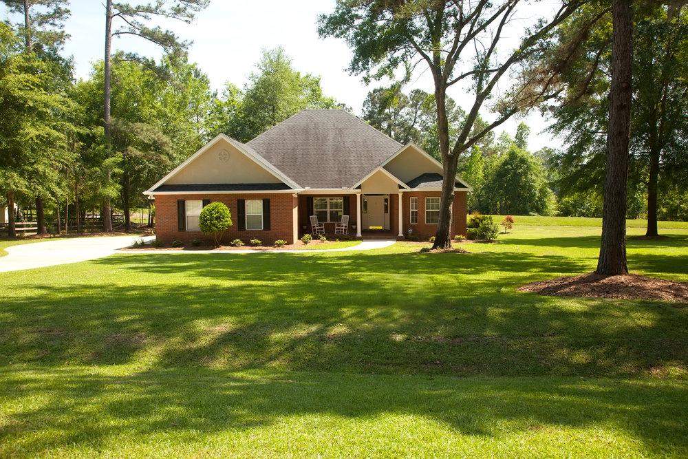 Embrace serenity in this charming countryside home surrounded by lush greenery.