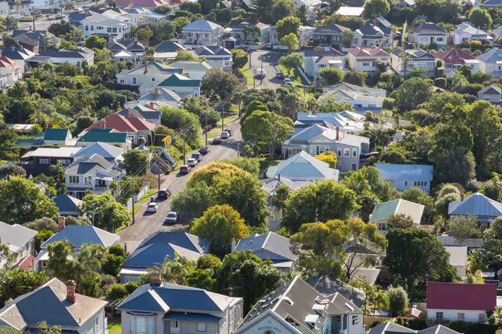 A picturesque suburban neighborhood nestled in lush greenery, where charming homes and tree-lined streets create a serene retreat.
